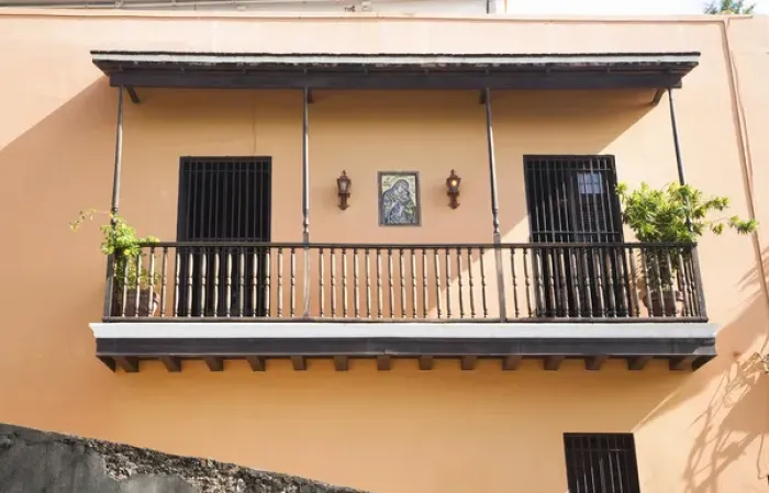 Framed Print : San Juan, Puerto Rico - Two doors with bars on them are set into a peach colored