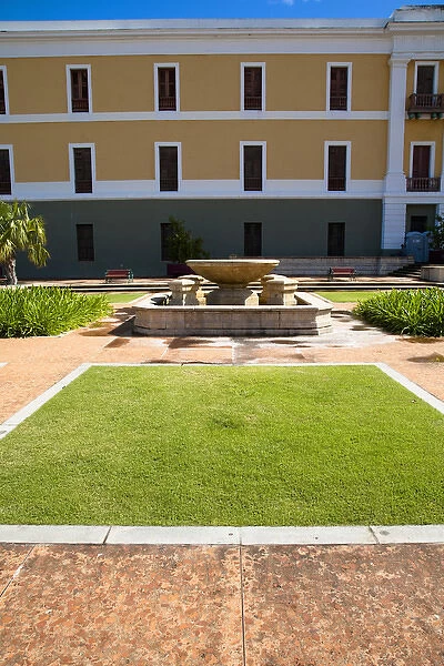 San Juan, Puerto Rico - A hotel fountain in a courtyard is sitting with no water in it