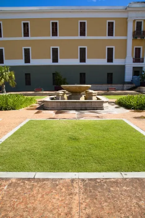 Framed Print : San Juan, Puerto Rico - A hotel fountain in a courtyard is sitting with no water in it Framed Print : San Juan, Puerto Rico - A hotel fountain in a courtyard is sitting with no water in it