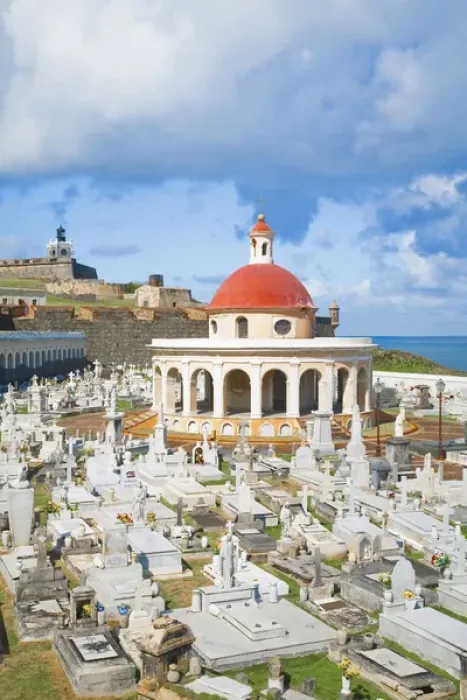 Framed Print : San Juan, Puerto Rico - An orange dome tops a building in a cemetery. In the background