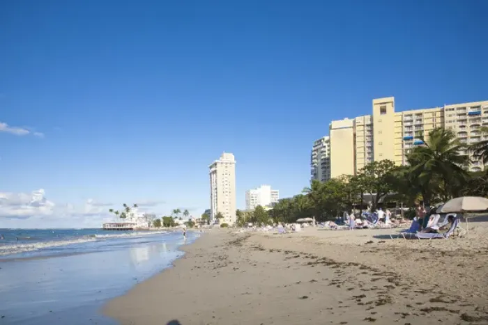 Framed Print : San Juan, Puerto Rico - People are relaxing in beach chairs on the beach of a resort hotel Framed Print : San Juan, Puerto Rico - People are relaxing in beach chairs on the beach of a resort hotel
