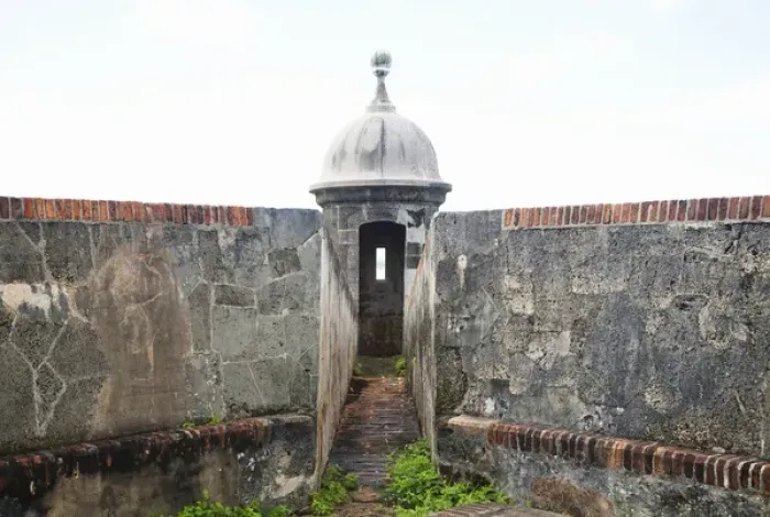 Framed Print : San Juan, Puerto Rico - Stone walls lead to a narrow passage way going to a watchtower