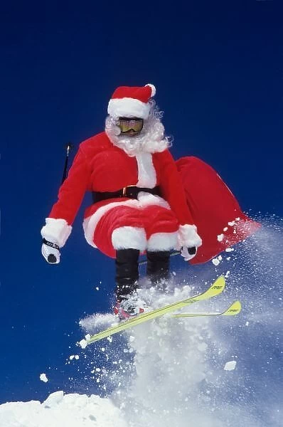 Santa Claus on skis jumping off a cornice at Snowbird, Utah