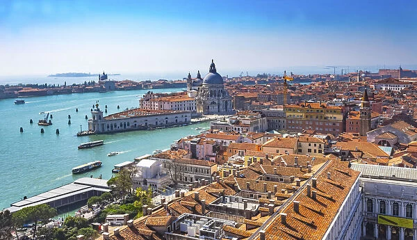 Santa Maria della Salute and Grand Canal with orange roofs and neighborhoods in Venice