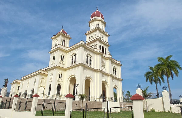 Santiago Cuba famous church called Basilica El Cabre with steeple and green grass