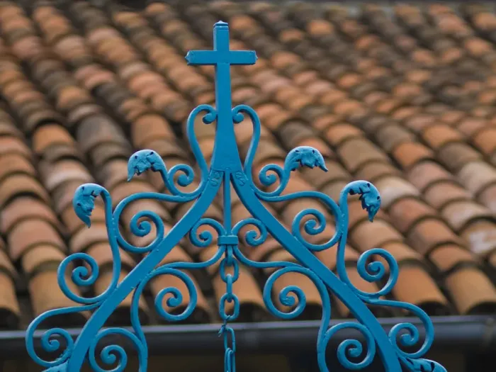 Framed Print : Santiago de Cuba, red tile roof and blue wrought iron cross