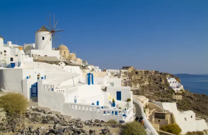 Framed Print : Santorini Greece and the beautiful white buildings on the mountain cliffs of Framed Print : Santorini Greece and the beautiful white buildings on the mountain cliffs of