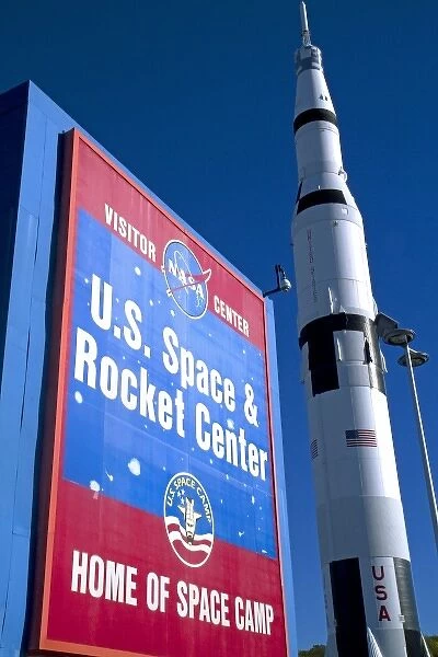 Saturn V mock-up stands next to the U. S. Space and Rocket Center sign located in Huntsville