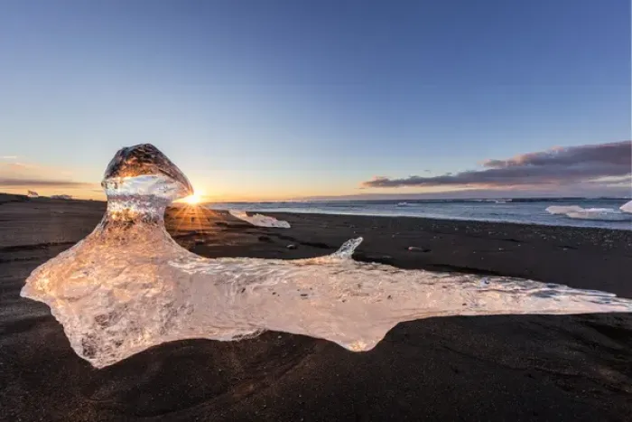 Framed Print : Scattered ice from icebergs on black sand beach at Joklusarlon, Iceland