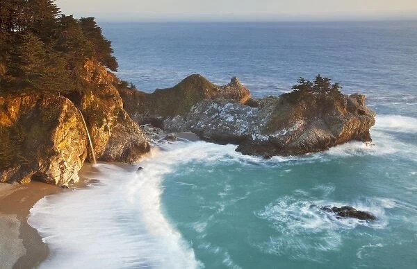 Scenic McWay Falls tumbles into the beach and the Pacific Ocean at Julia Pfeiffer