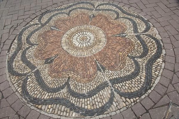Scotland, Edinburgh. Historic Rose Street, with stone mosaic rose design in street