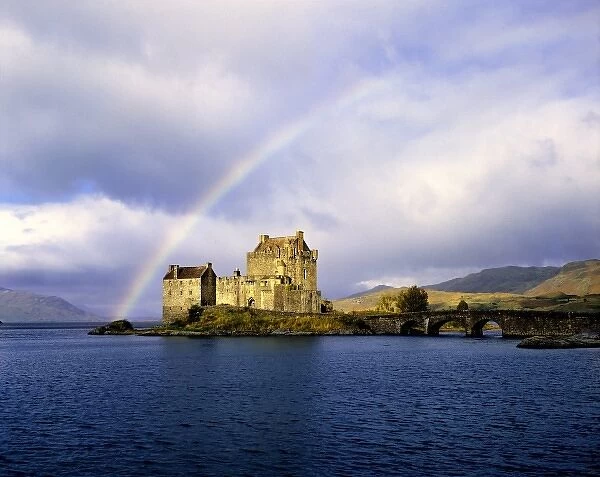 Scotland, Highland, Wester Ross, Eilean Donan Castle. A rainbow frames beautiful