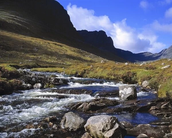 Scotland, Perthshire, Rannoch Moor. A stream rushes down from the mountains near