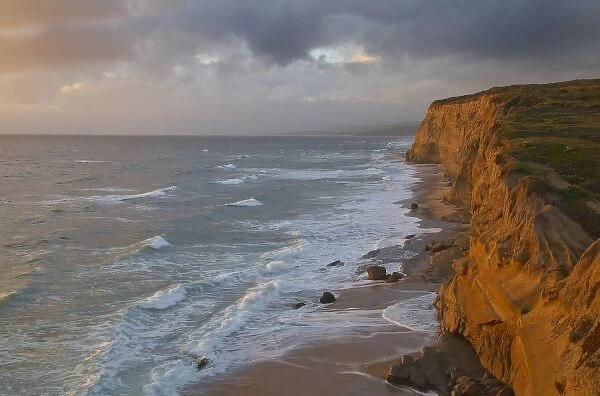Sea cliffs catch days last light at Pomponi State Beach in San Mateo County, California