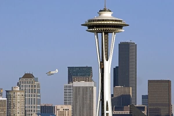Sea plane flying over the city of Seattle and the Space Needle in Washington
