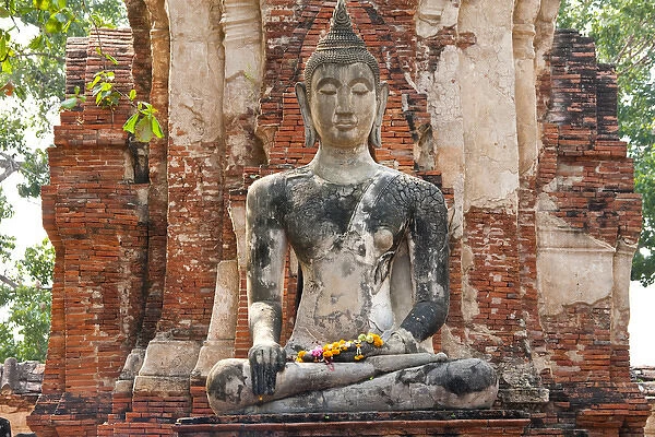 Seated Buddha statue at the temple of Wat Mahatat in Ayutthaya near Bangkok, Thailand