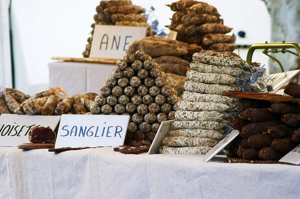 selling sausages of donkey, cow, wild boar and more at The market in Carpentras, Vaucluse
