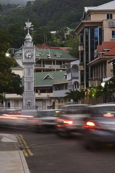 Seychelles, Mahe Island, Victoria, town clocktower and evening traffic