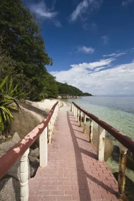 Framed Print : Seychelles, Praslin Island, Anse Bois de Rose, seaside promenade at the Coco de Mer hotel