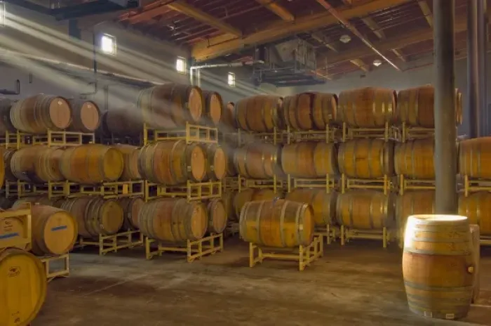 Framed Print : Shafts of light in barrel room of Montevina Winery. Established in 1970, bought by Framed Print : Shafts of light in barrel room of Montevina Winery. Established in 1970, bought by