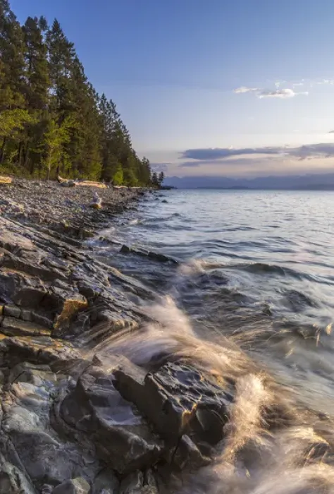 Framed Print : Shoreline of Flathead Lake receives sunrise light at West Shore State Park near Lakeside