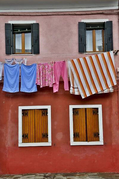 Shuttered windowsand hanging to dry laundry Burano, Italy