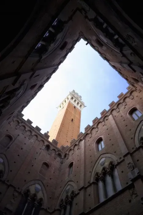 Framed Print : Sienna, Tuscany, Italy - Low angle view looking up from the enclosed courtyard of an old building Framed Print : Sienna, Tuscany, Italy - Low angle view looking up from the enclosed courtyard of an old building