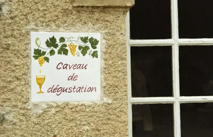 Framed Print : A sign outside the tasting room saying caveau de degustation. Chateau Mourgues du Gres Gres Framed Print : A sign outside the tasting room saying caveau de degustation. Chateau Mourgues du Gres Gres