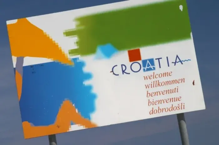 Framed Print : Sign saying Croatia Welcome with a picture of a person on a beach Orebic town, south Framed Print : Sign saying Croatia Welcome with a picture of a person on a beach Orebic town, south