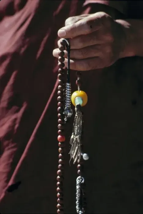 Framed Print : Sikkim, Gangtok. A monk holds graceful prayer beads at Rumtek Monastery, Gangtok, Sikkim