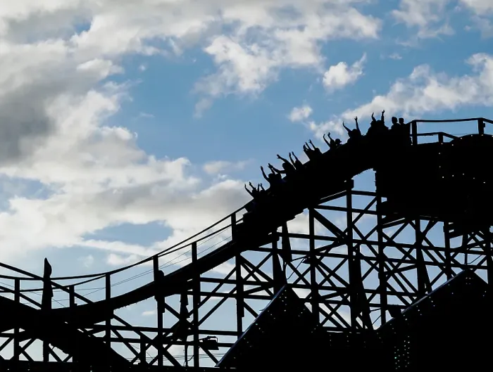Framed Print : Silhouette of people raising their hands on a roller coaster Framed Print : Silhouette of people raising their hands on a roller coaster