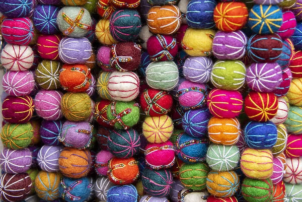 Singapore, Chinatown. Detail of typical textile round wool hanging ball souvenirs