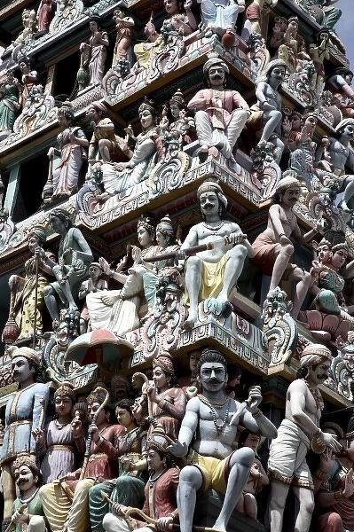 Singapore. A closed up view of Hindu Religious figures decorating the entrance of