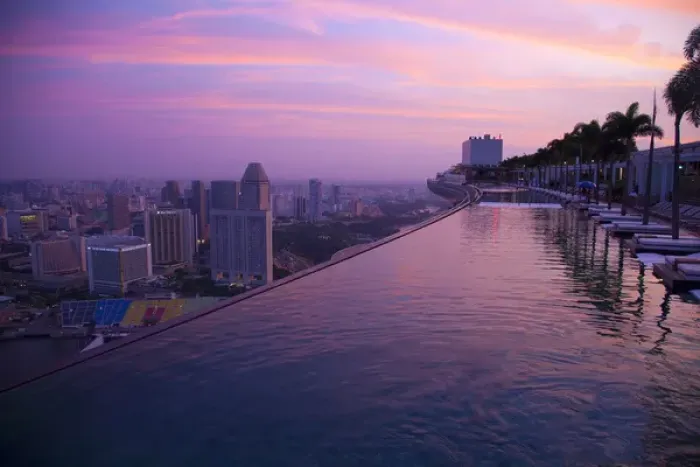 Framed Print : Singapore, Marina Bay Sands Hotel. Cantilevered hotel swimming pool at sunrise. Credit as Framed Print : Singapore, Marina Bay Sands Hotel. Cantilevered hotel swimming pool at sunrise. Credit as