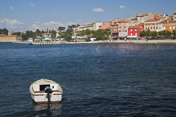 Single small boat docked in the harbor at Rovigno, Croatia