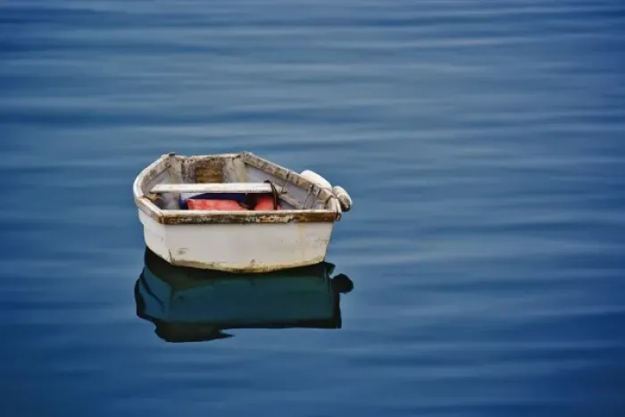 Framed Print : Single small boat floating on ocean, Maine Framed Print : Single small boat floating on ocean, Maine