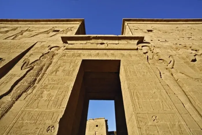 Framed Print : Skyward view of entry pylons and giant figures, Temple of Philae, on Agilika, an Framed Print : Skyward view of entry pylons and giant figures, Temple of Philae, on Agilika, an