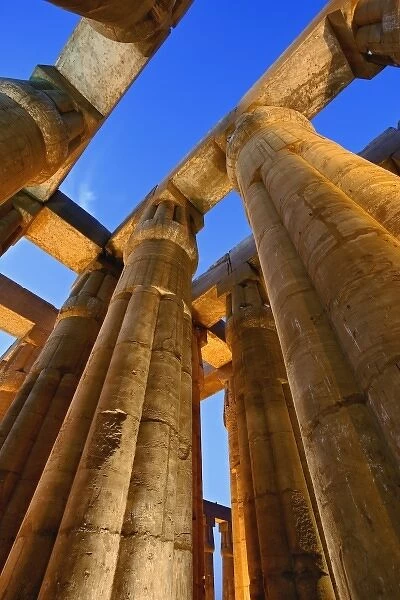 Skyward view of massive columns at sunset, Luxor Temple located at modern day Luxor