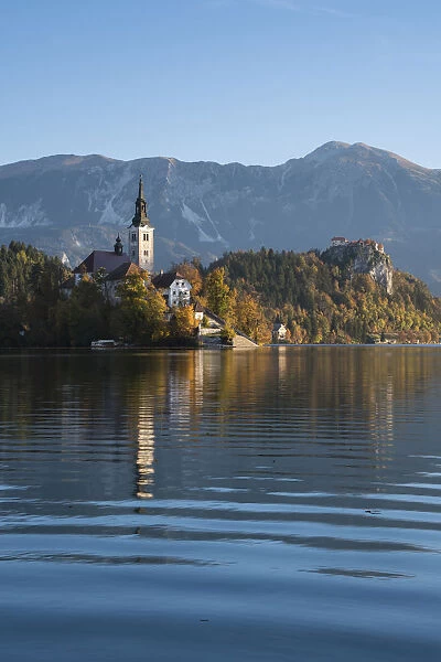Slovenia, Bled. The Church of the Assumption of Maria is reflected in the calm waters