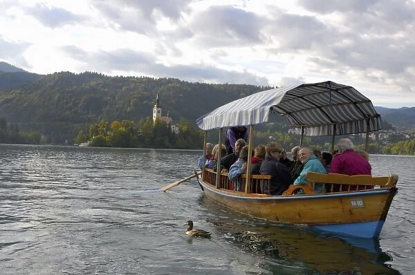 Slovenia, Bled, Lake Bled, pletna boat and Bled Island chapel