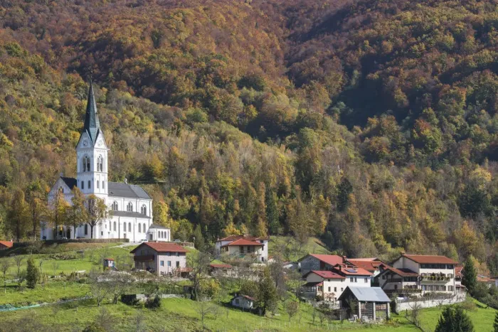 Framed Print : Slovenia, Dreznica. Parish Church of the Sacred Heart towers above the village, surrounded Framed Print : Slovenia, Dreznica. Parish Church of the Sacred Heart towers above the village, surrounded