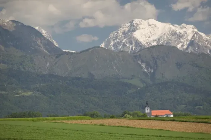 Framed Print : SLOVENIA-GORENJSKA-Moste: Church & Field with Kamnik-Savinja Alps  /  Summer