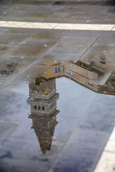 Slovenia, Piran. Reflection of a tower after the rain