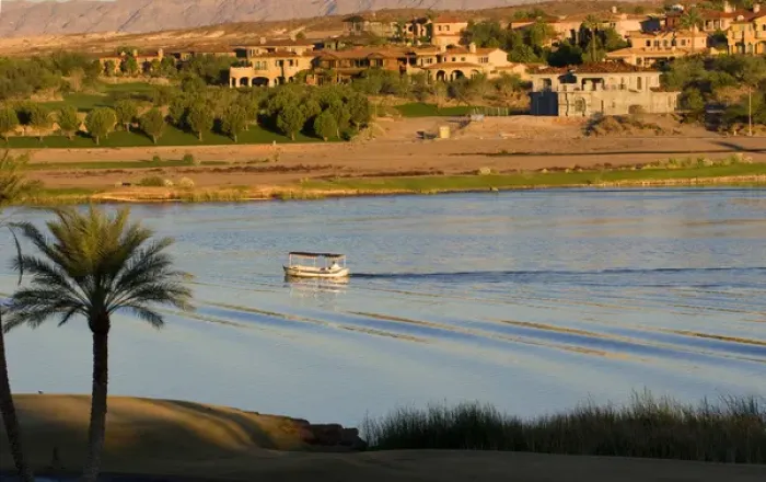 Framed Print : A small boat makes a wake in Lake Las Veagas with new homes in the background