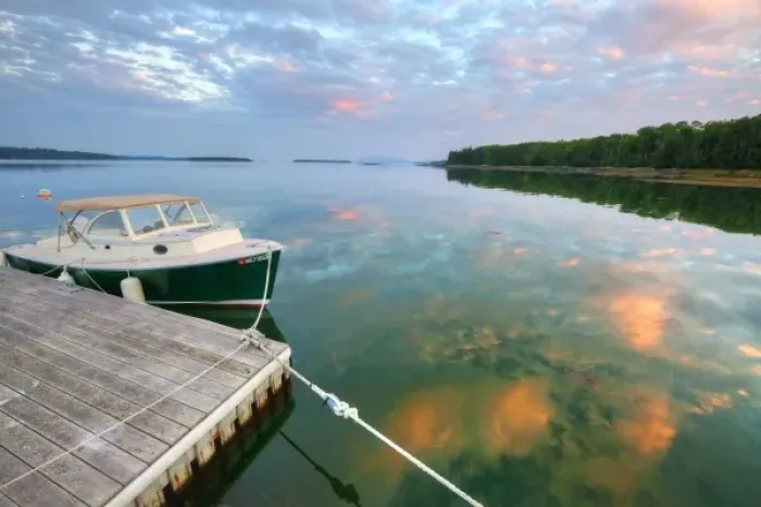 Framed Print : Small pleasure boat at dock while sunset clouds reflect in Sullivan Bay near Hancock Framed Print : Small pleasure boat at dock while sunset clouds reflect in Sullivan Bay near Hancock
