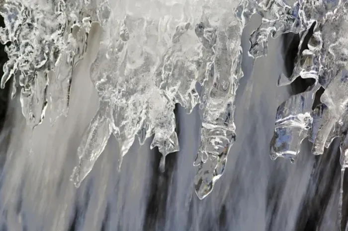 Framed Print : Small waterfall encased in ice near Logan Pass at Glacier National Park in Montana Framed Print : Small waterfall encased in ice near Logan Pass at Glacier National Park in Montana