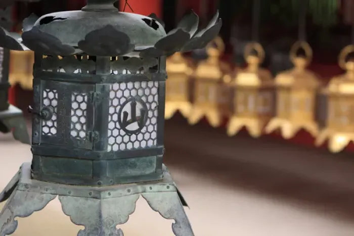 Framed Print : Smaller metal and gold lanterns are representations of their ancient stone siblings Framed Print : Smaller metal and gold lanterns are representations of their ancient stone siblings
