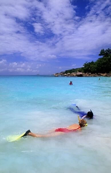 Snorklers in the water at the beautiful perfect scene of the famous waters at La
