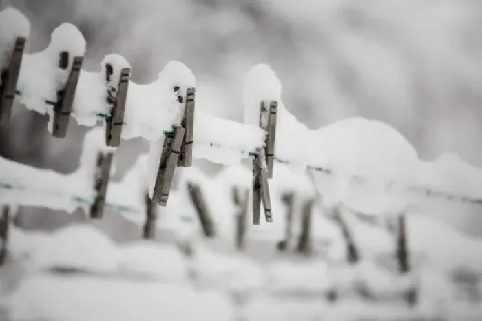 Framed Print : Snow on clothes pins on a clothes line Framed Print : Snow on clothes pins on a clothes line