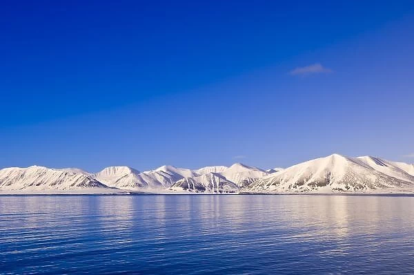 Snowcapped peaks Woodfjord Svalbard Archipelago, Norway